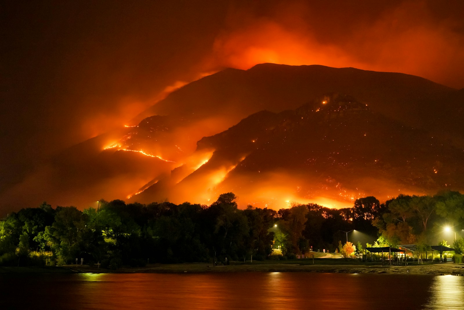 a large fire is burning in the mountains, house, wild fire